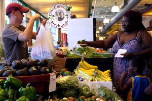 Image of woman buying produce