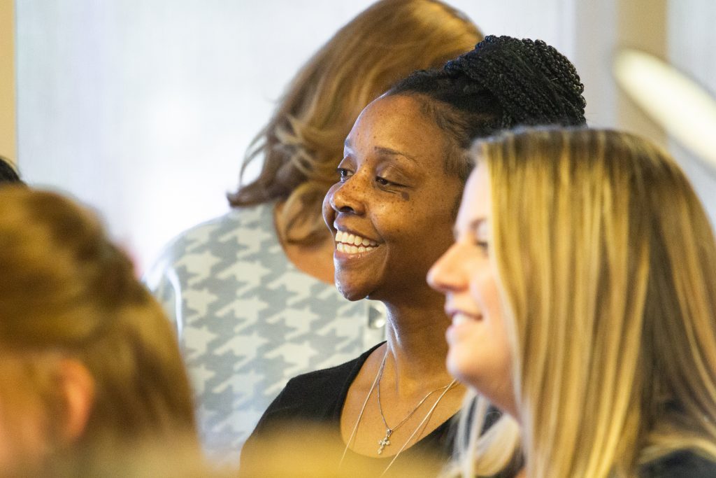 Women smiling at something off camera